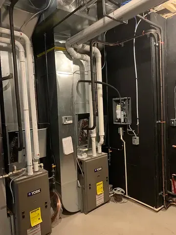 High-efficiency furnace and venting installed by Burt’s Breeze